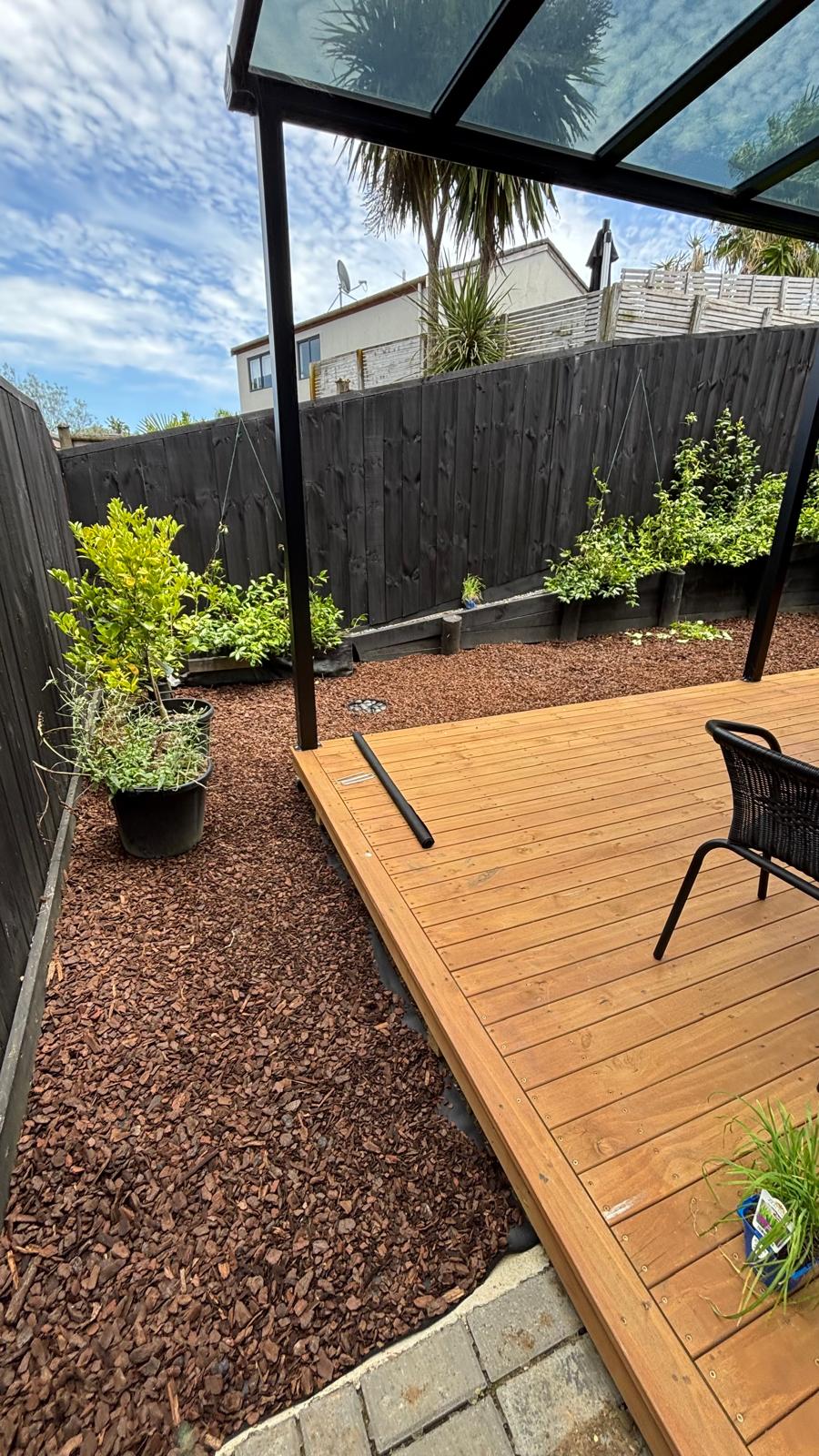 Garden and deck after lawn care service